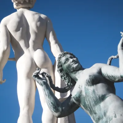 woman statue that looks like it's fingering the anus of another statue
