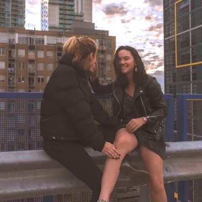 two women on a date laughing and touching with things to talk about